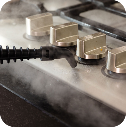 Handheld steam cleaner nozzle degreasing stainless steel stovetop knobs without chemicals